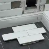 tiles being installed in a home bathroom | Pacific Bay Construction