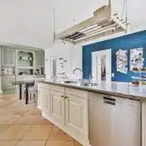 bright and airy kitchen interior with teal wall 2026 03 18 11 04 47 utc | Pacific Bay Construction