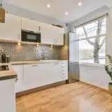 bright kitchen interior with wood floors and appli 2026 03 18 08 17 39 utc | Pacific Bay Construction